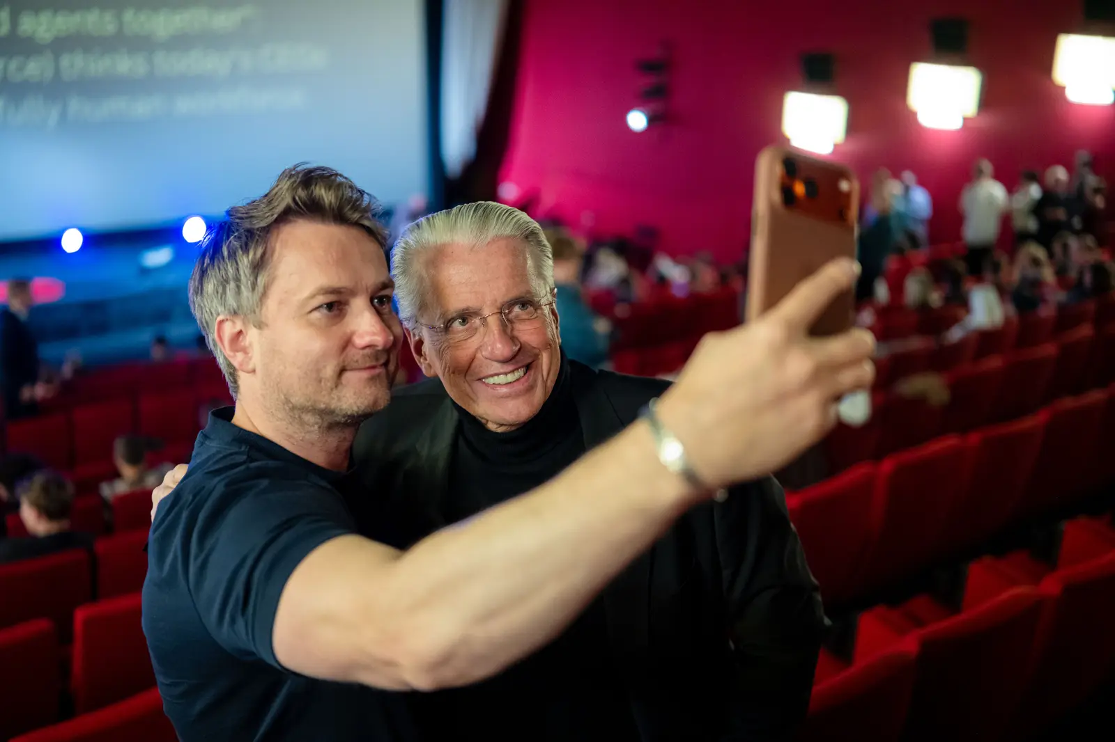 Two guests taking a selfie in the hall